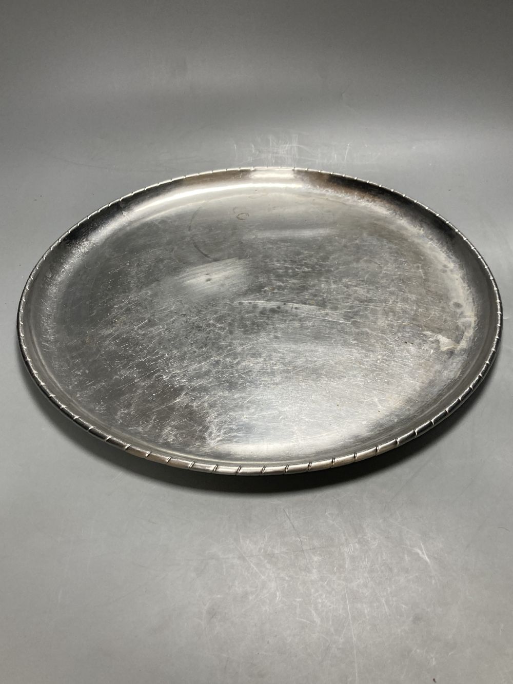 A Keswick School of Industrial Arts planished pewter tray, diameter 38cm